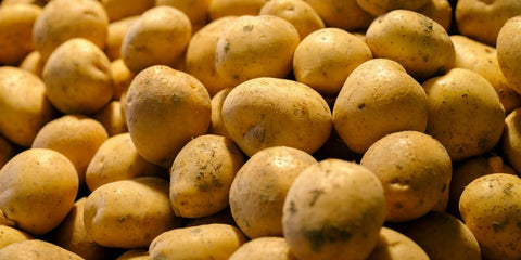 a pile of potatoes sitting on top of a table